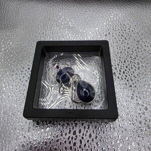 black onyx gemstones wrapped in sterling silver wire